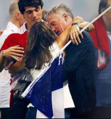 Claude Deschamps embracing her spouse Didier Deschamps and son Dylan Deschamps after World Cup Victory